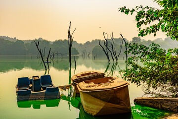 View of Hauz khas lake with  background medieval era islamic madrasa. It is major tourist attraction in Delhi.
