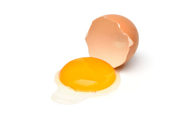 Egg yolk  half eggshell isolated on a white background.