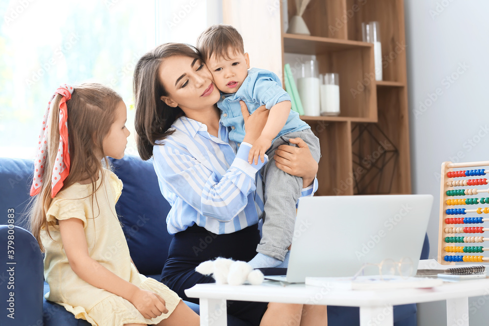 Sticker Working mother with little children at home