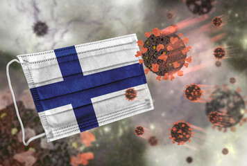 Face mask with flag of Finland, defending coronavirus - 379801415