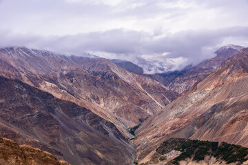 Fototapeta na wymiar Barren cold desert mountain landscape of Spiti mountain valley located high in rain shadowed region of Himalayas in Himachal Pradesh, India.