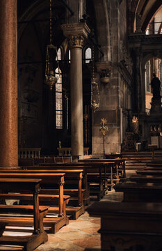 Church of San Stefano detail /sunlight illuminating prayers bench.Venice /Italy