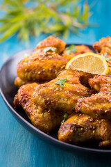 Crispy chicken wings Asia style with with sesame seeds