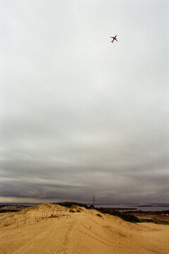 A plane takes off over Wanda Sand Dunes