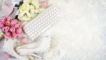 White aesthetic wedding bridal theme desktop workspace with high heel shoes, bouquets and...
