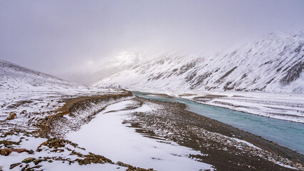 Snow covered beautiful landscape of Chandra river valley in Spiti during winter.  Spiti means 'The Middle Land' is a cold desert mountain valley located high in Himalayas of Himachal Pradesh, India.