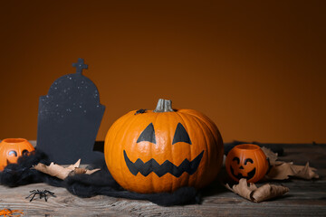Composition with Halloween pumpkin on table