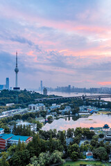 Fototapeta premium Early morning colorful clouds at Guishan TV Tower and Yangtze River Bridge in Wuhan, Hubei, China
