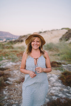 Beautiful woman in mountains of sea coast