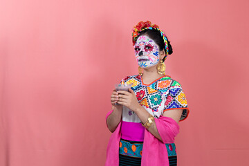 A young woman disguised as a catrina