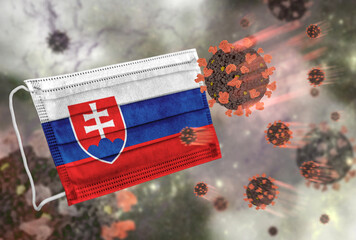 Face mask with flag of Slovakia, defending coronavirus - 379806884