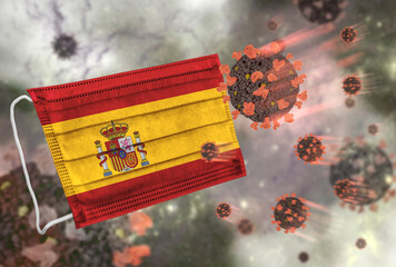 Face mask with flag of Spain, defending coronavirus - 379807265