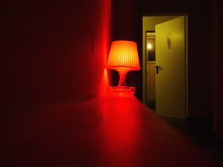 Red lighting lamp on shelf