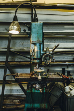 oily old dirty turqouise vintage drilling machine