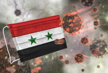 Face mask with flag of Syria, defending coronavirus - 379807642