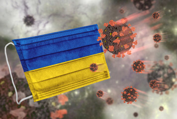 Face mask with flag of Ukraine, defending coronavirus - 379808092