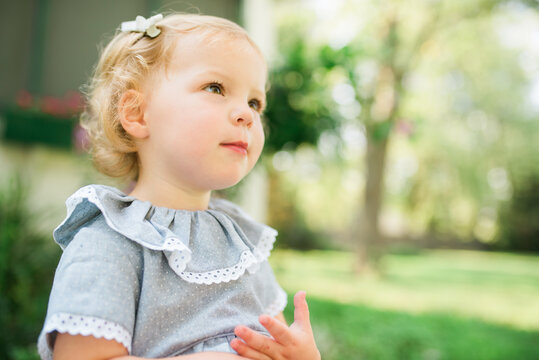 Two young twins playing outside in the summertime