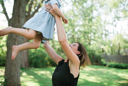 Two young twins playing outside in the summertime