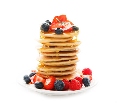 Tower of pancakes with strawberries and honey, close-up