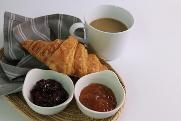 cup of coffee and croissant with Marmalade and Strawberry Jam