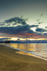 Rusty broken shipwreck on sea shore