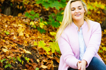 Woman relaxing in autumn park