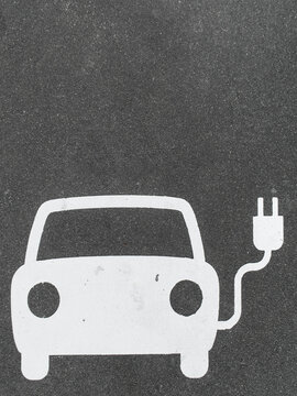 Parking spot for an electric car, charging station