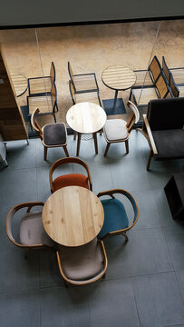 Top view of furniture, table, and chairs inside a cafe.