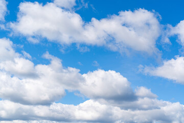 Naklejka na ściany i meble Blue sky with clouds. Typical midday sky
