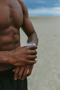 Black Sporty Man Using His Smartwatch