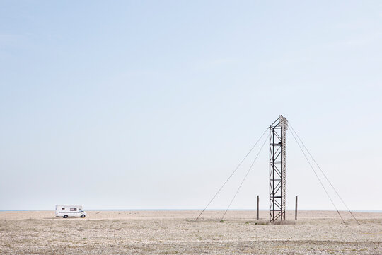 Camper van on a pebble beach