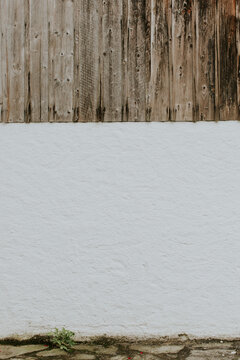Background of wood over stone wall