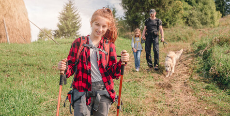 Fototapeta premium Teenage girl trekking in sunny mountains