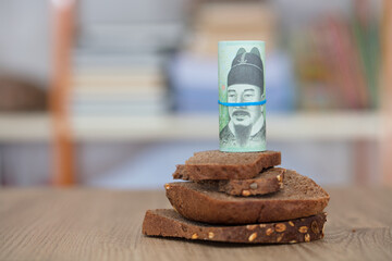 Black bread and Korean won banknotes