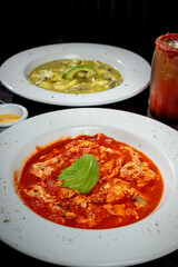 Mexican dish of Aporreadillo in red sauce