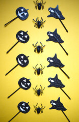 halloween party celebration accessories set on yellow background