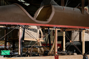 Wicker seats in renovation of world war one twin seat aircraft.
