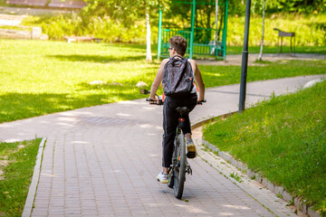 Fototapeta premium Cyclist ride on the bike path in the city Park