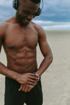 Young Man Training with a Smart Watch
