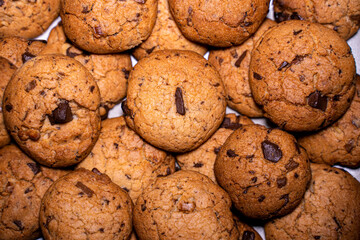 Cookies on a plate with low light. Top view.