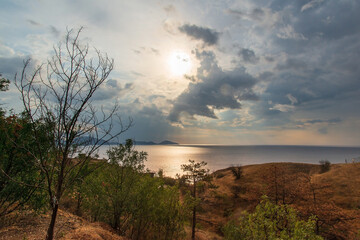 Fototapeta na wymiar Dawn on the sea, view from the mountains. Crimea, Koktebel.