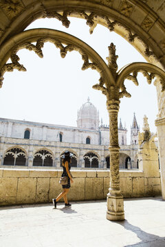 Alone tourist visting a monastery in Lisbon, Portugal.