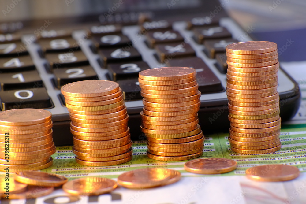 Wall mural stacks of gold money coin on table background and concept saving money