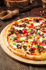 Closeup on pizza with minced meat and vegetables