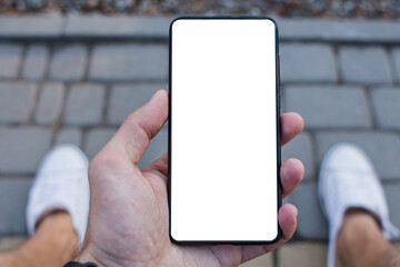 smartphone with a white screen in a man's hand