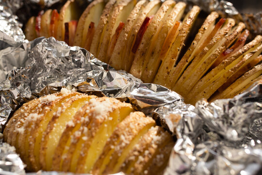 Baked potatoes on a peasant in foil - Powered by Adobe