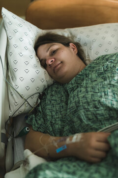Woman lying in hospital bed during induction