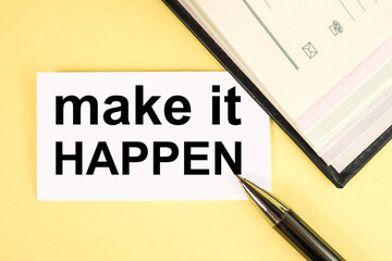 make it happen. text on white paper on yellow background