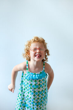 Funny little girl showing grimace