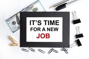 its time for a new job. text on white paper in black frame on light background